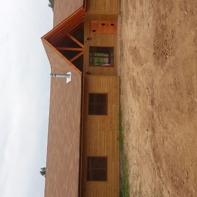 Casa cubierta con siding canadiense