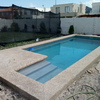 Vista lateral de Ingreso piscina